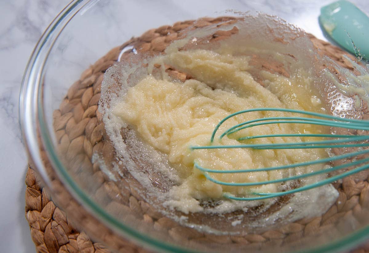 melted butter and sugar mixed together in a clear bowl