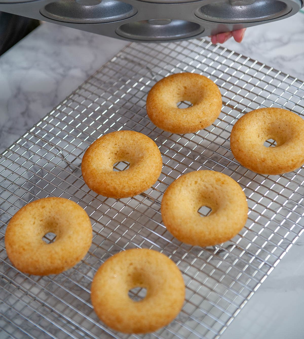 cooling baked donuts on a rack