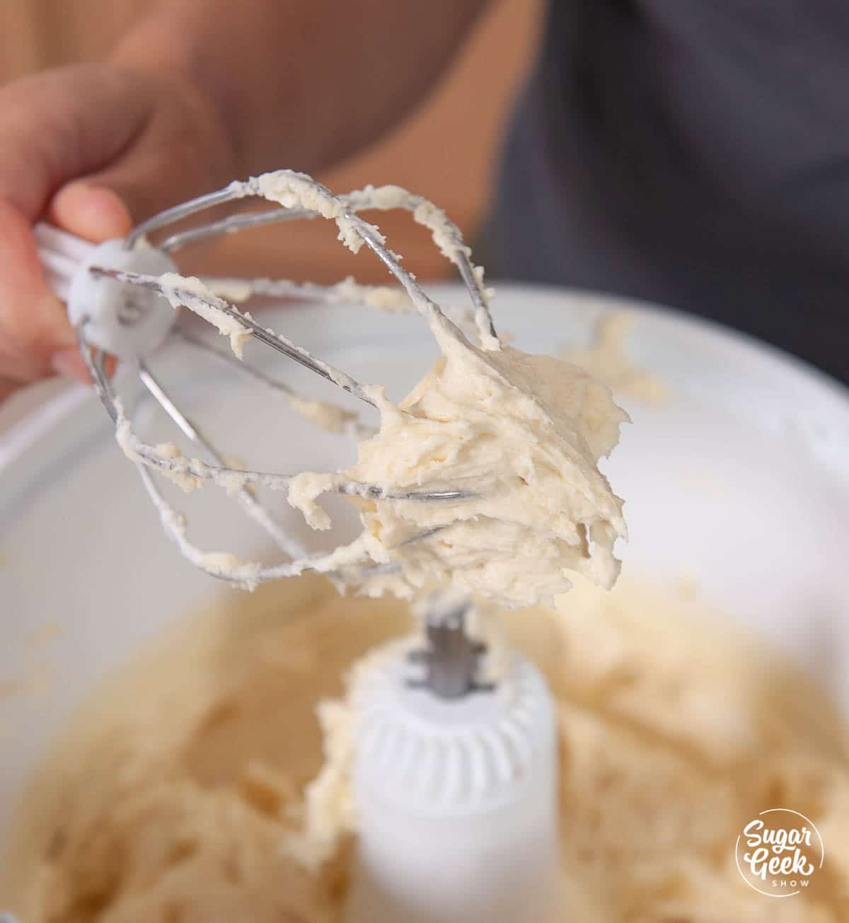 butter and sugar creamed together on a whisk