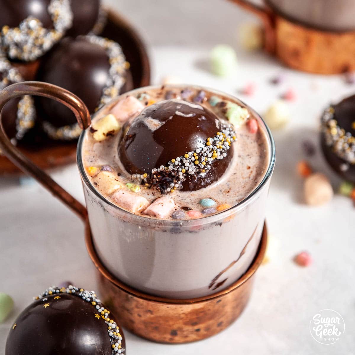 Hot chocolate cocoa bomb with hot milk in a copper mug