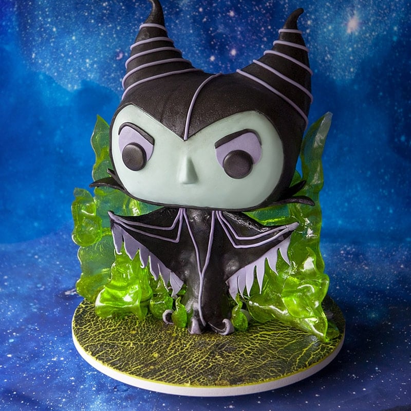 Sculpted cake that looks like a funko pop figurine in the likeness of Maleficent