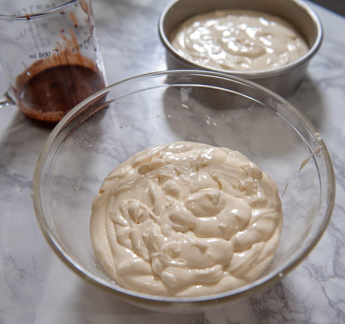 vanilla cake batter in a clear bowl