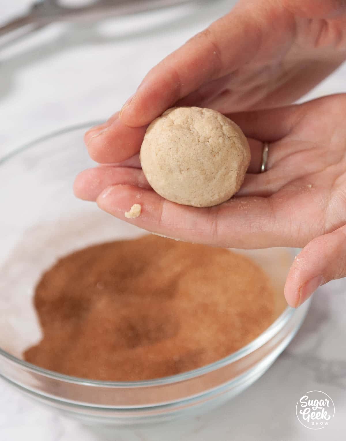snickerdoodle dough rolled into a ball