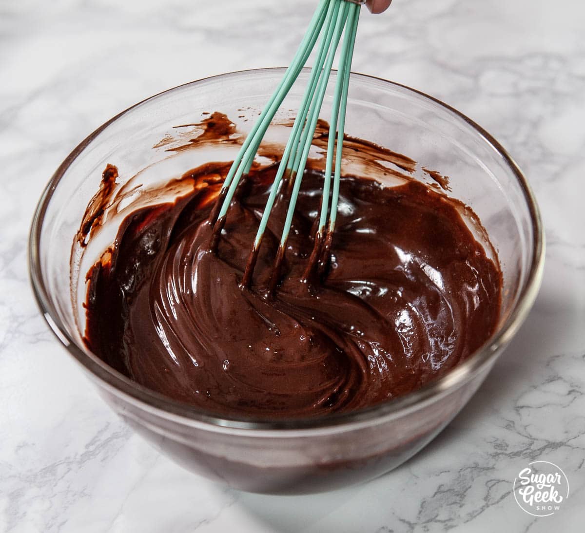 cocoa butter and melted butter whisked together in a clear bowl