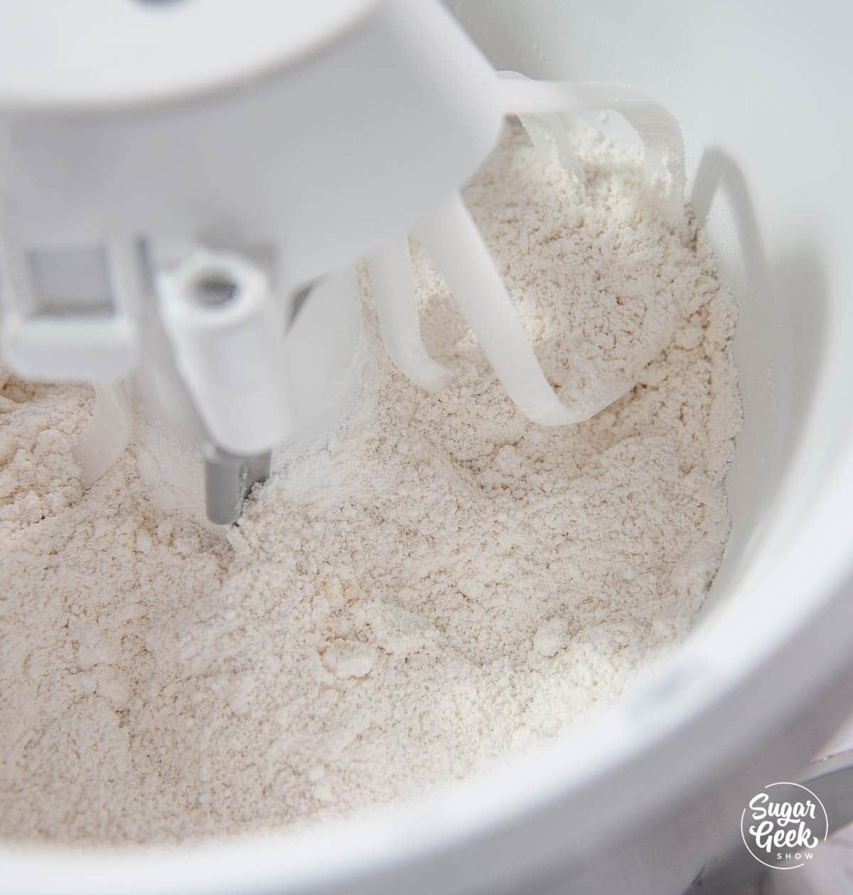 almond flour and powdered sugar in the bowl of a stand mixer