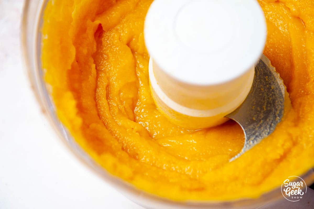 pumpkin puree shot from above in a food processor 
