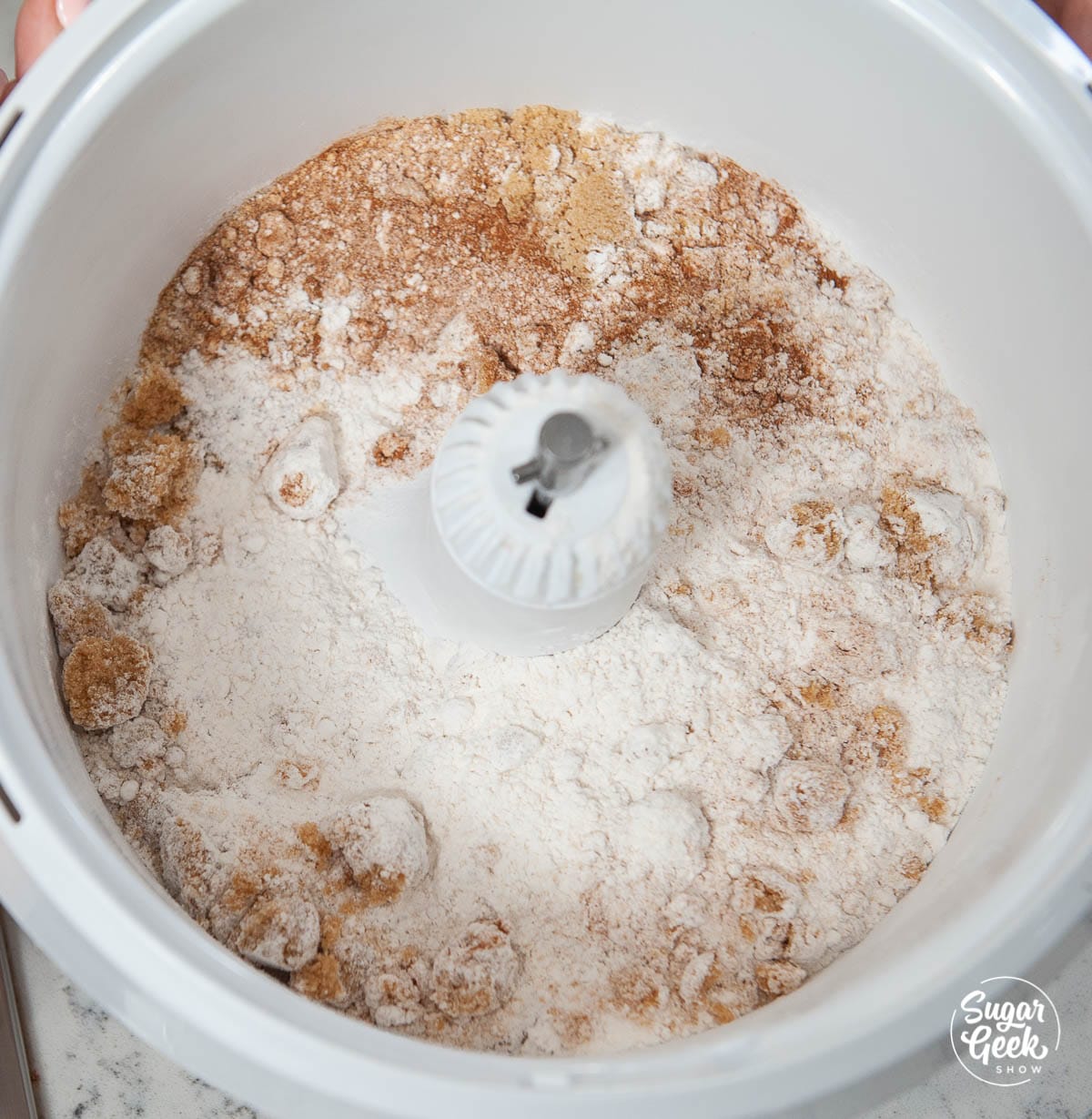 gingerbread cake dry ingredients in a white stand mixer bowl