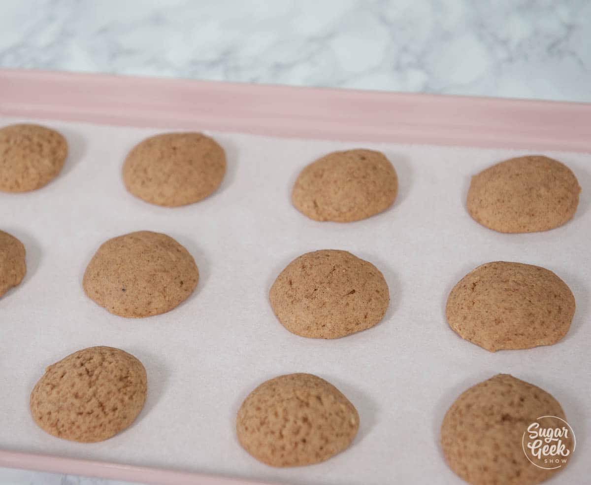 chai whoopie pies on a cookie sheet