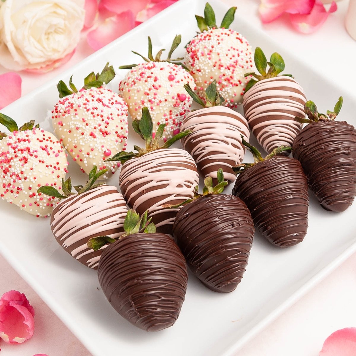 chocolate covered strawberries on a white plate