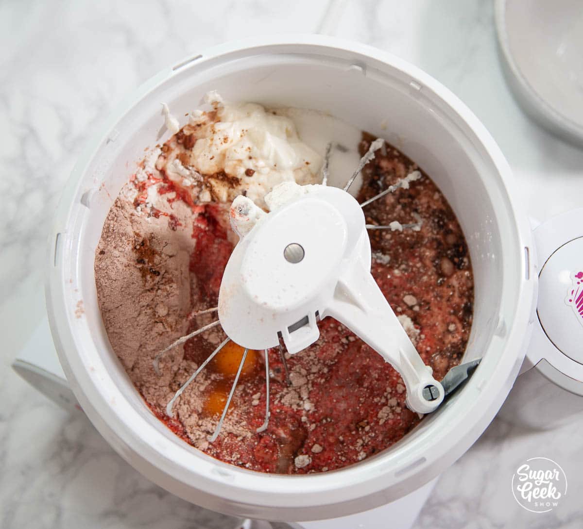 doctored red velvet cake ingredients in a bowl