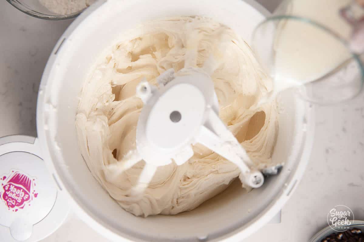 Close up of Oreo cake batter mixing in a stand mixer.