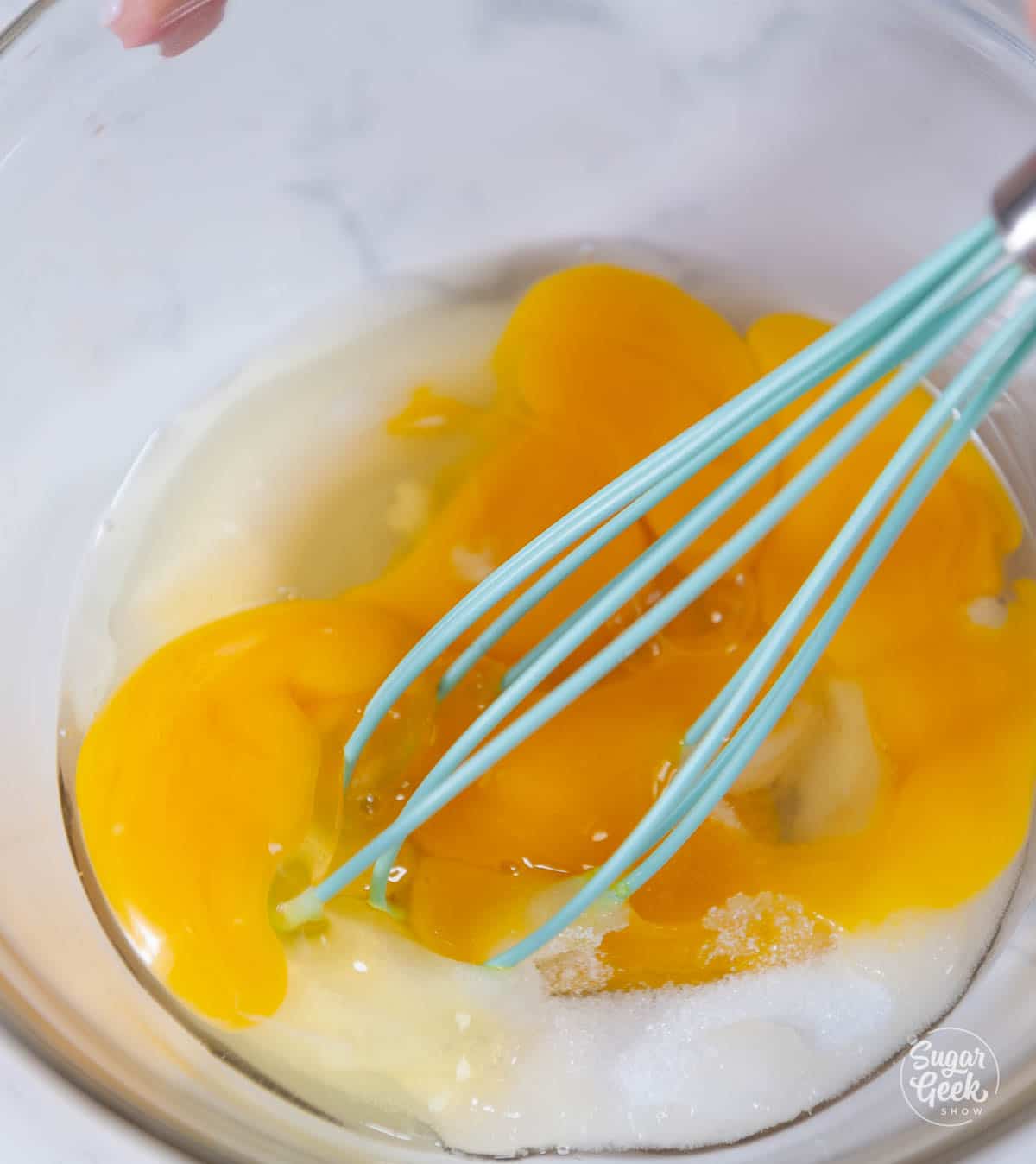close up of eggs and sugar being whisked