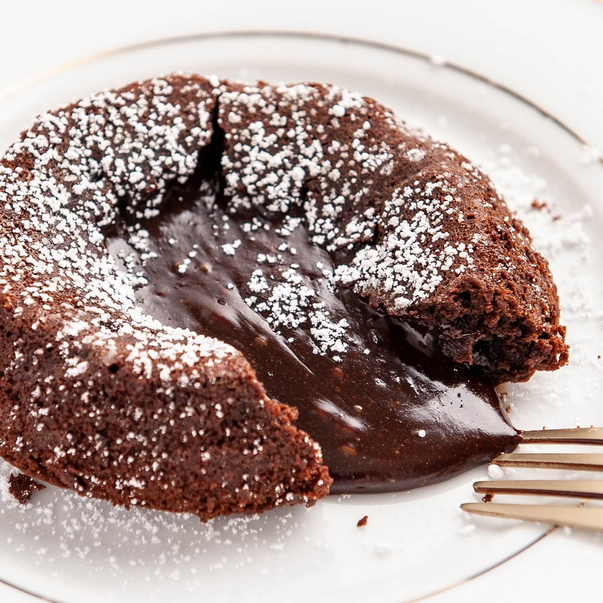 closeup of chocolate lava cake on a white plate