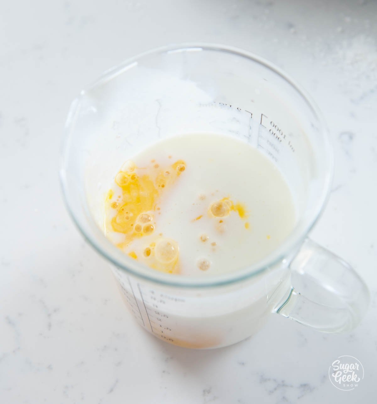buttermilk and eggs in a measuring cup