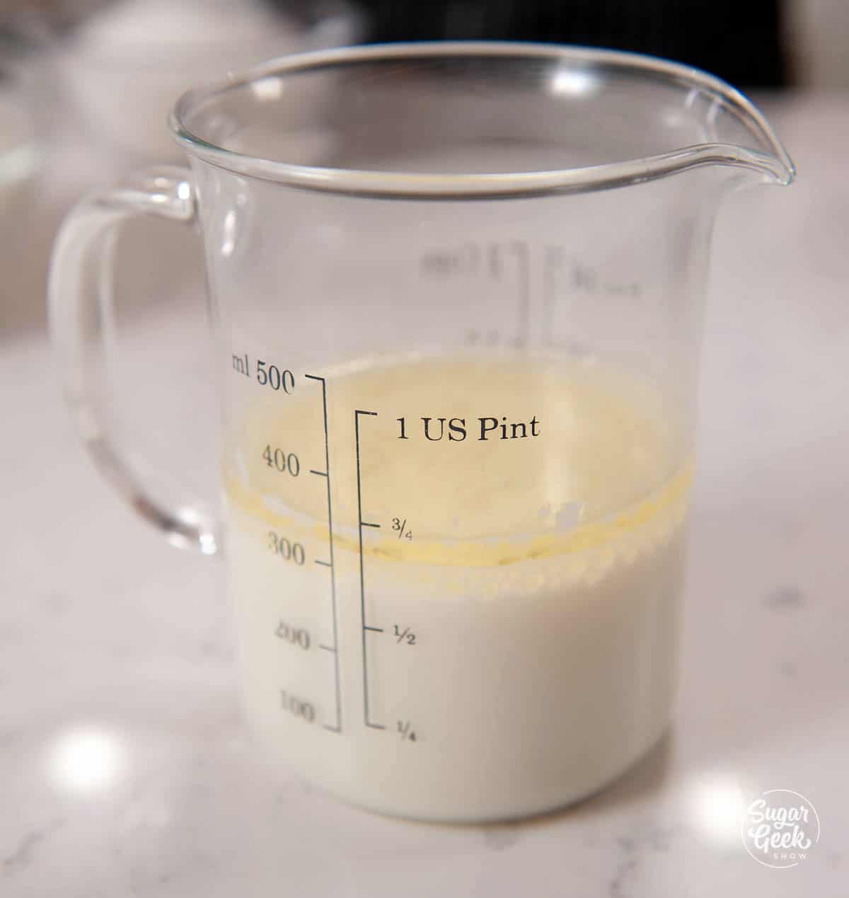 Oreo cake liquid ingredients in a measuring cup