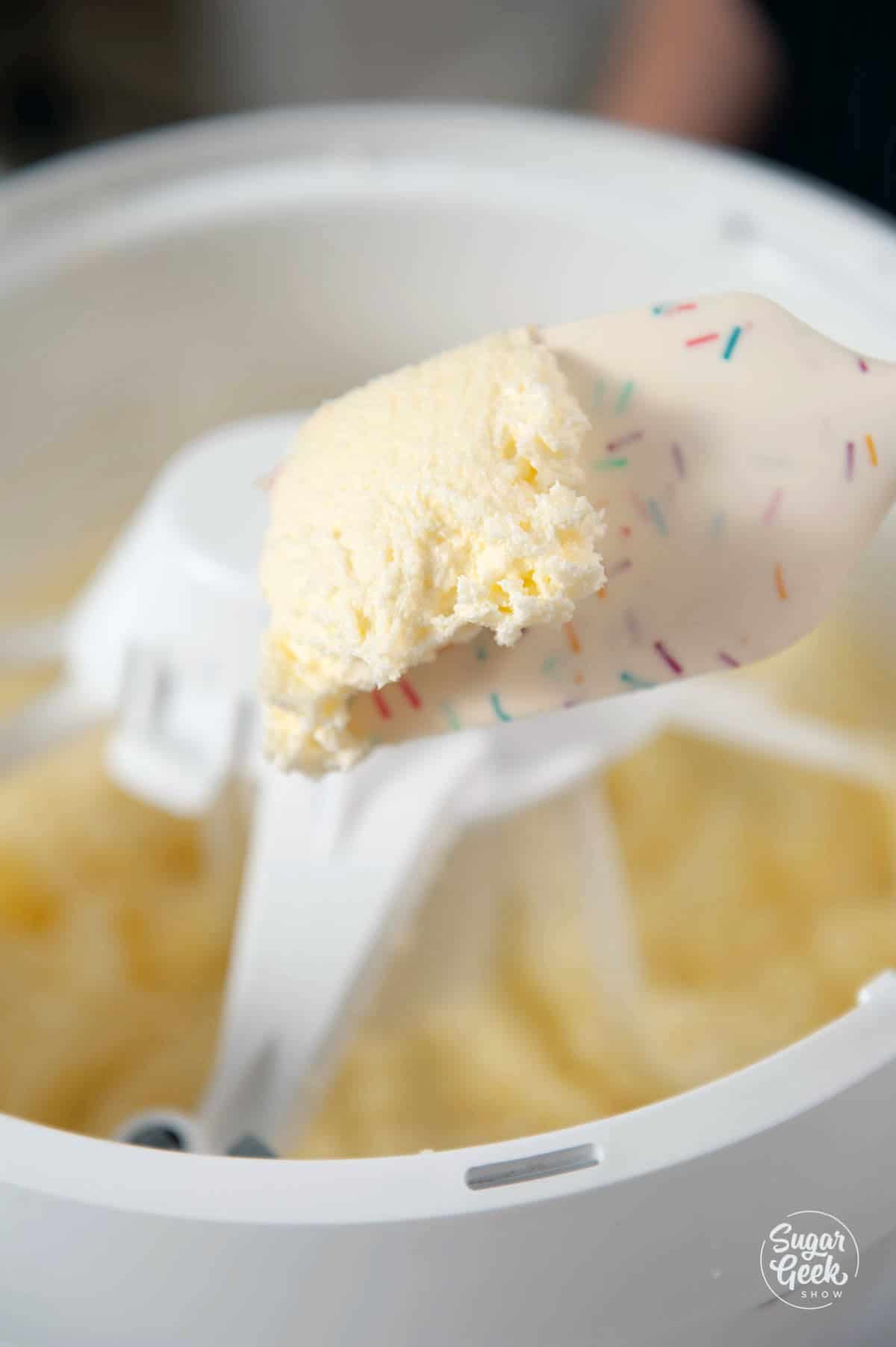 Close up of creamed butter and sugar in a stand mixer.