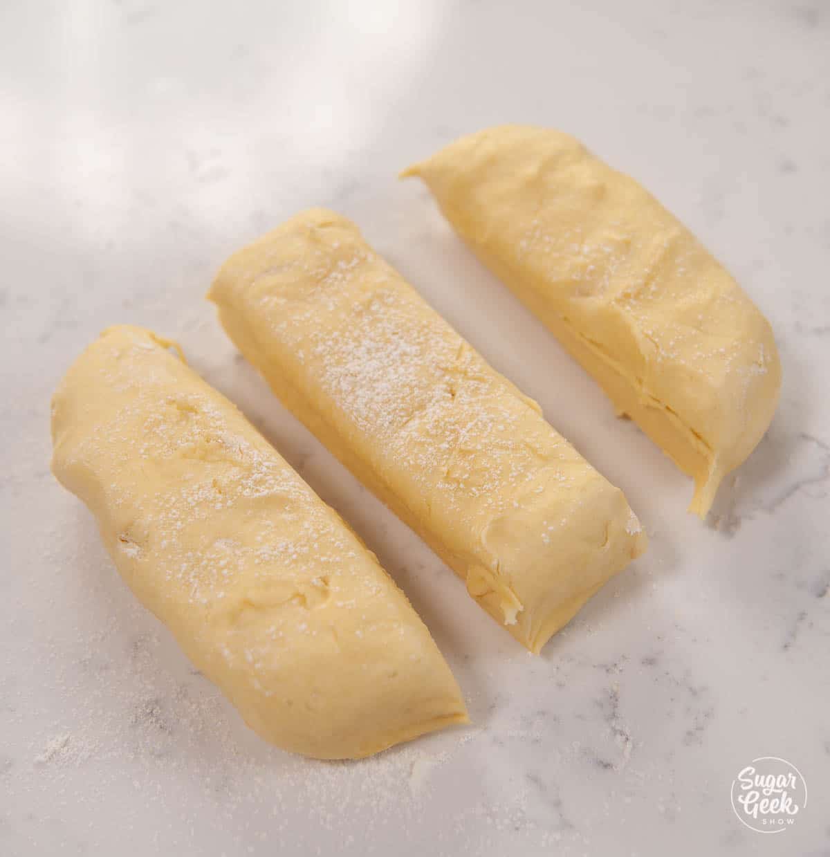 Brioche bread cut into three pieces.