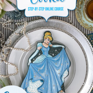 Cookie that is shaped and decorated to look like Cinderella.