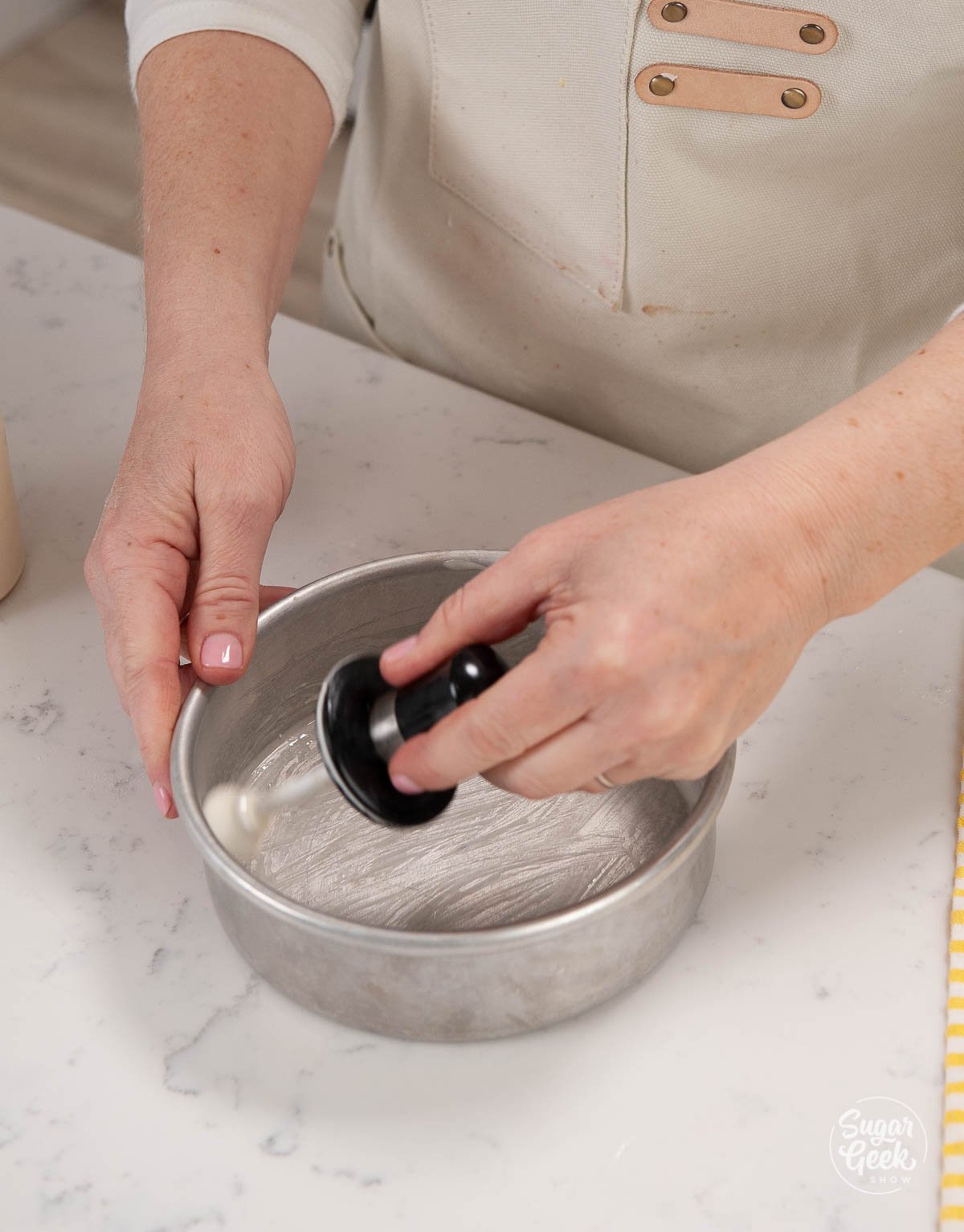 coating a cake pan in cake goop