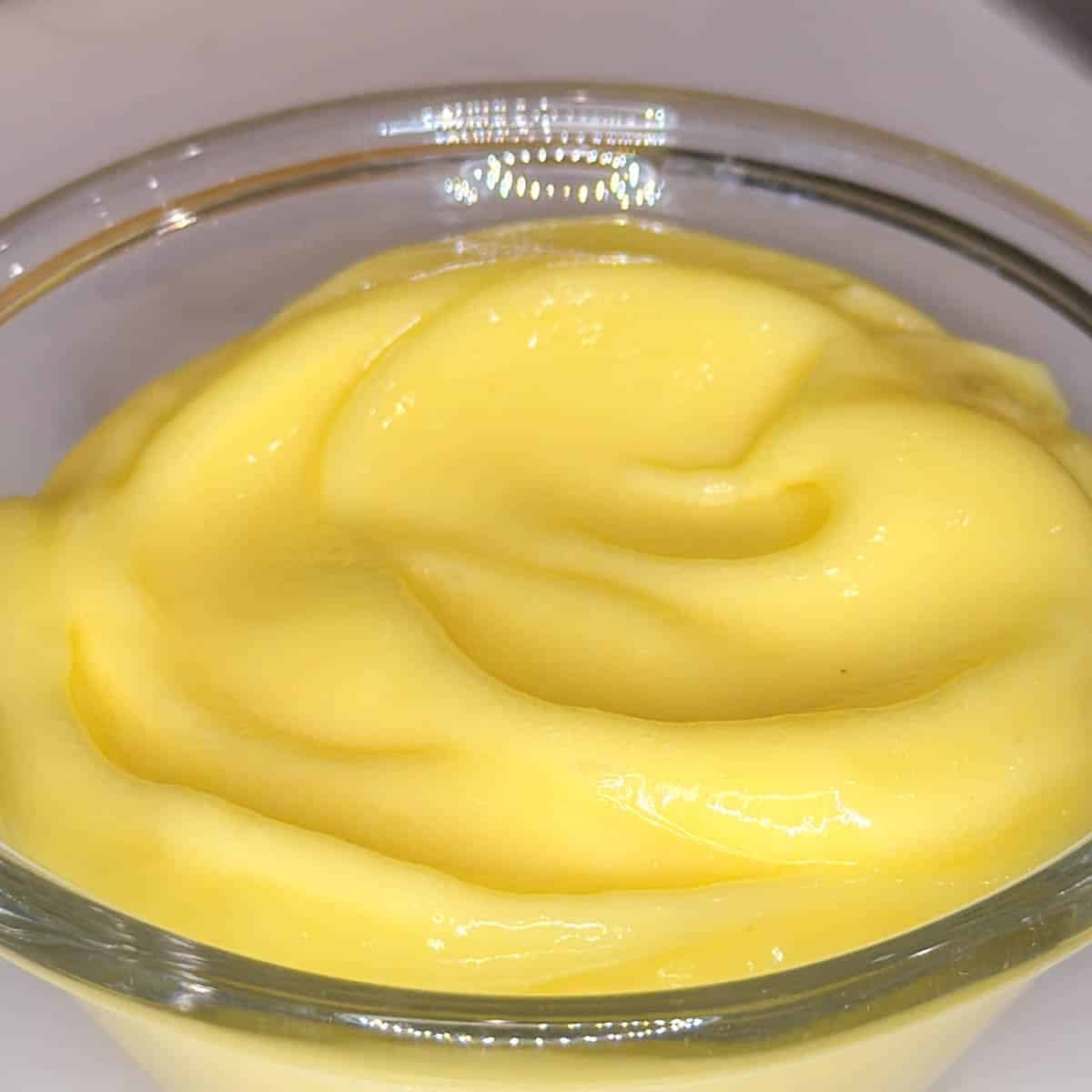 smooth lemon curd in a glass bowl