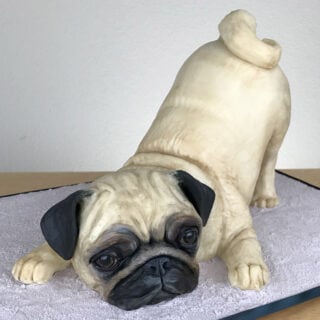Cake sculpted to look like a realistic pug dog