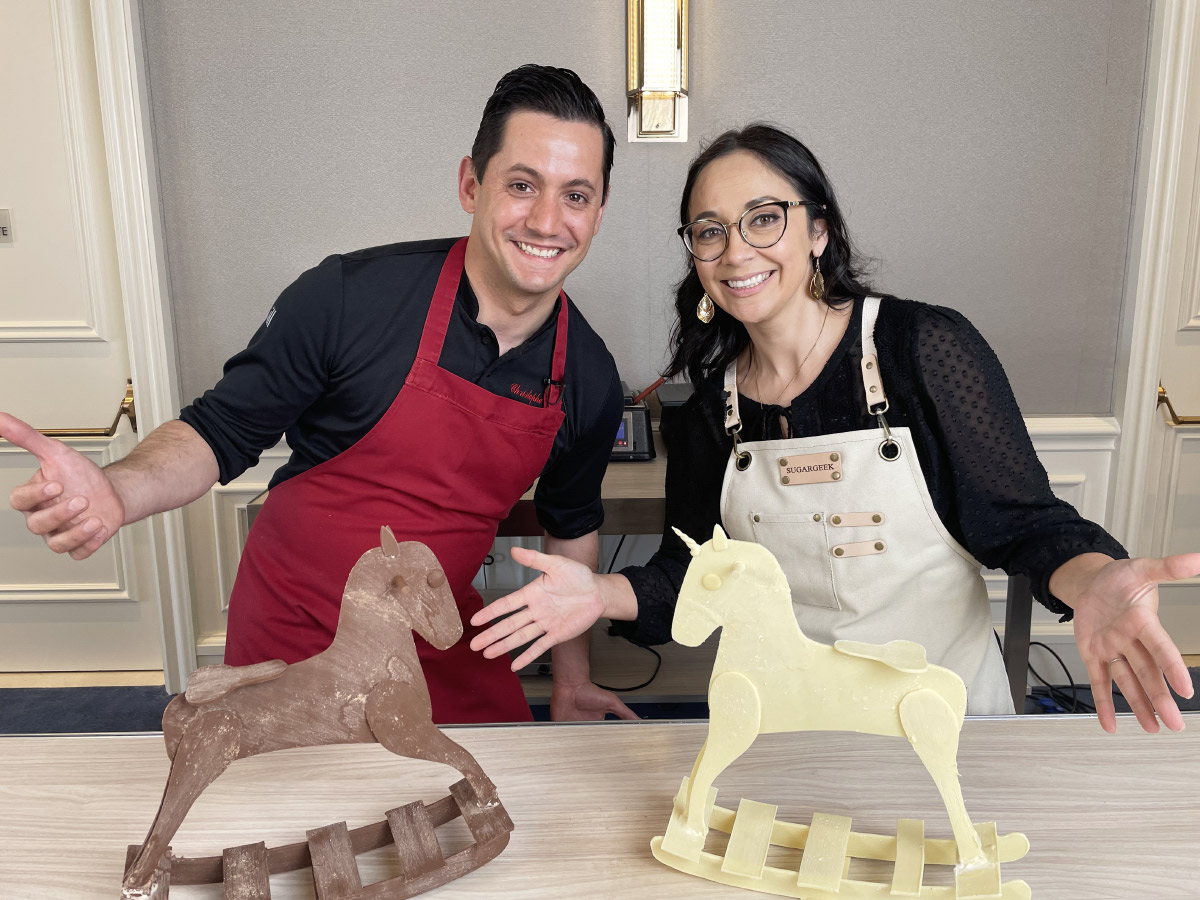 Christophe Rull and Liz Marek showing off their chocolate rocking horses they made using Christophe's techniques