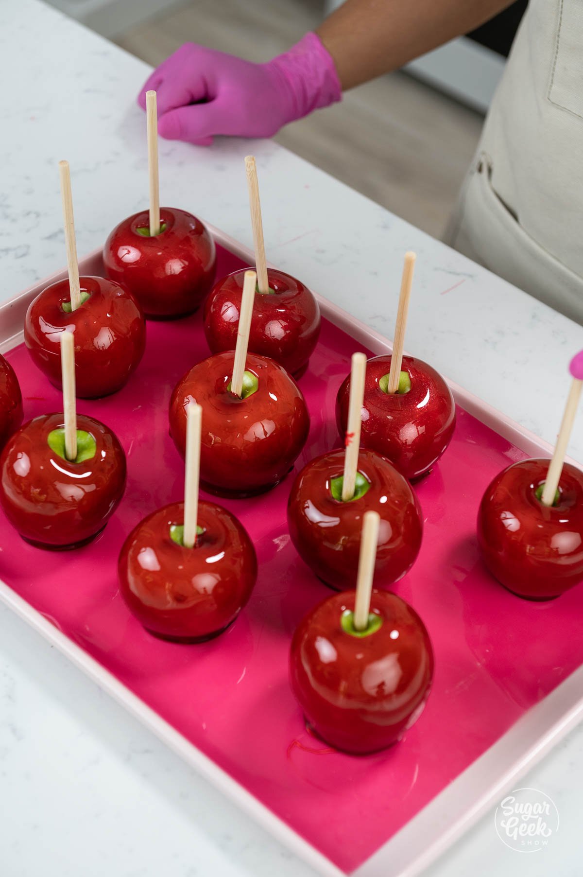close up of candy apples on a silicone mat