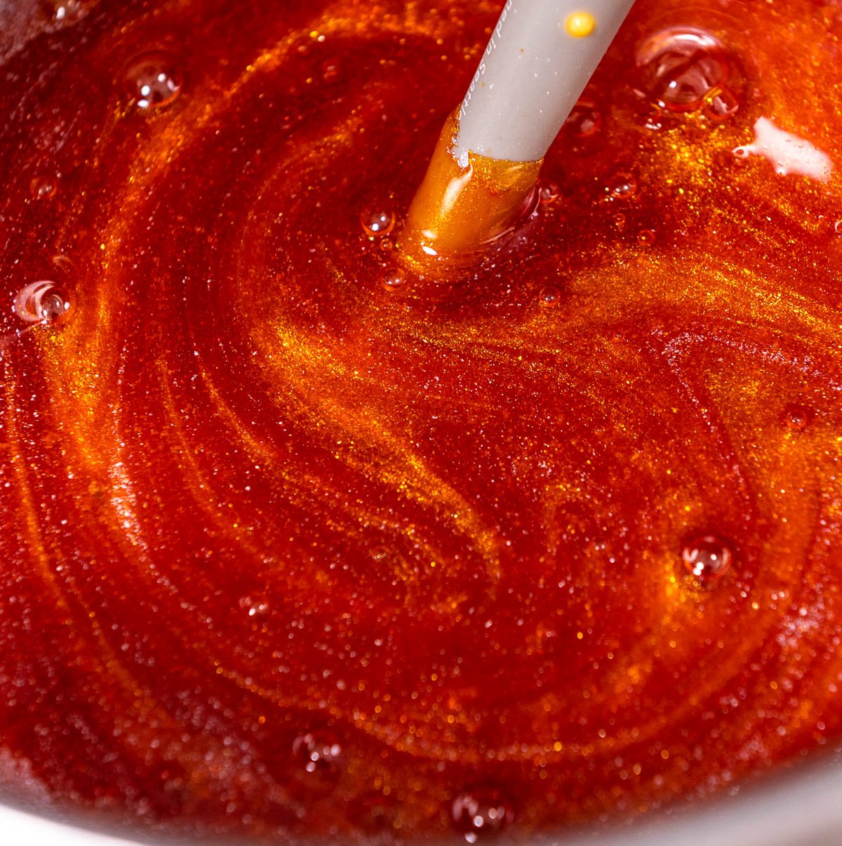 close up of candy apple mixture with flash dust