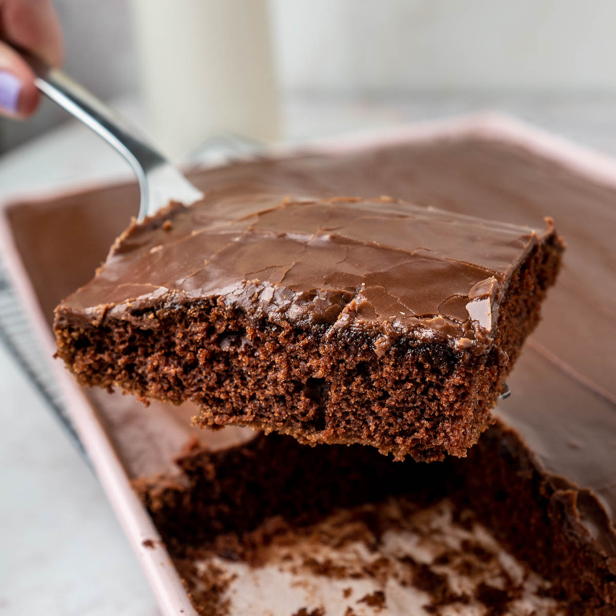 close up of texas sheet cake on a serving spoon