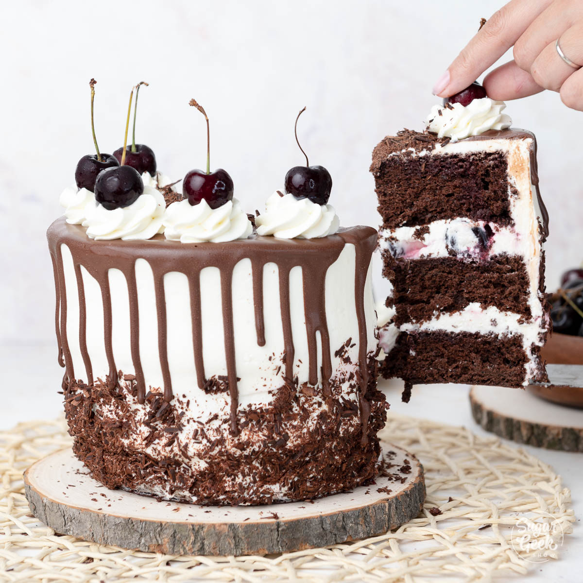 slice being removed from black forest cake