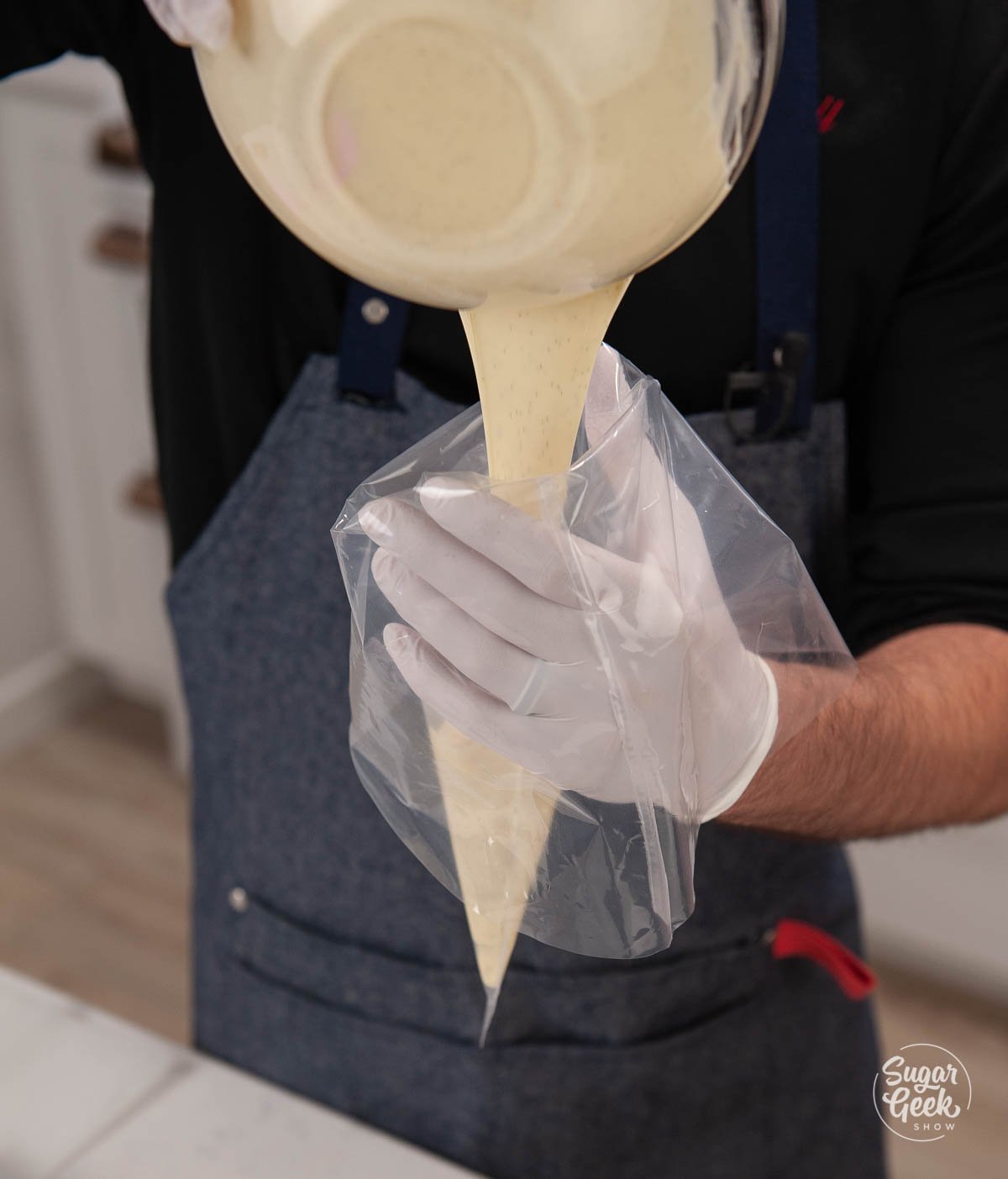 filling a piping bag with tempered white chocolate