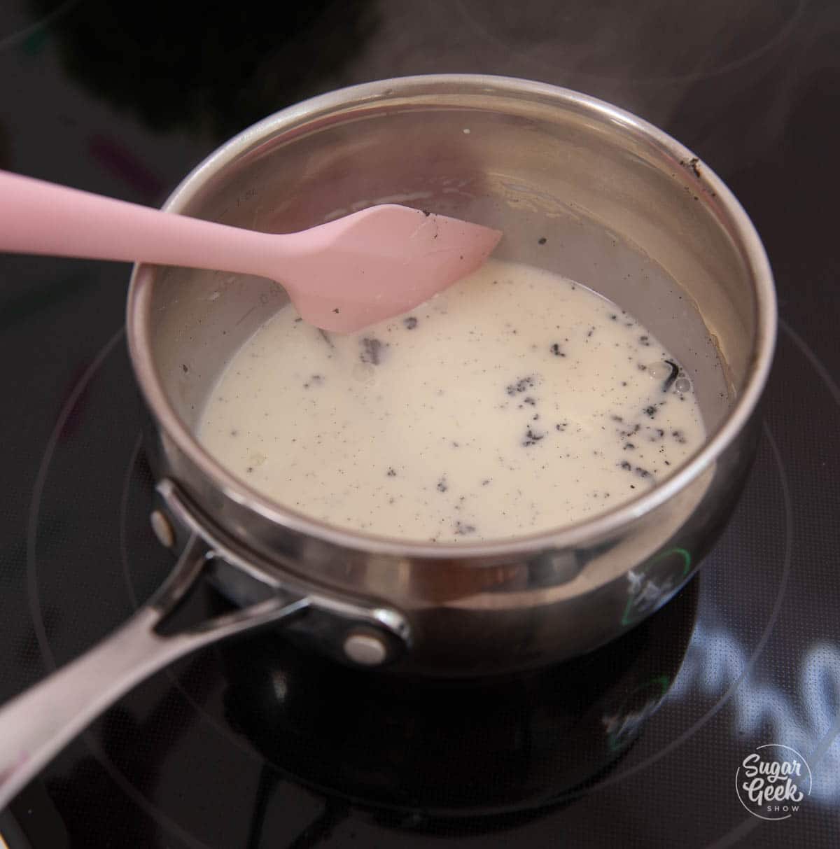 vanilla bean ganache ingredients in a saucepan