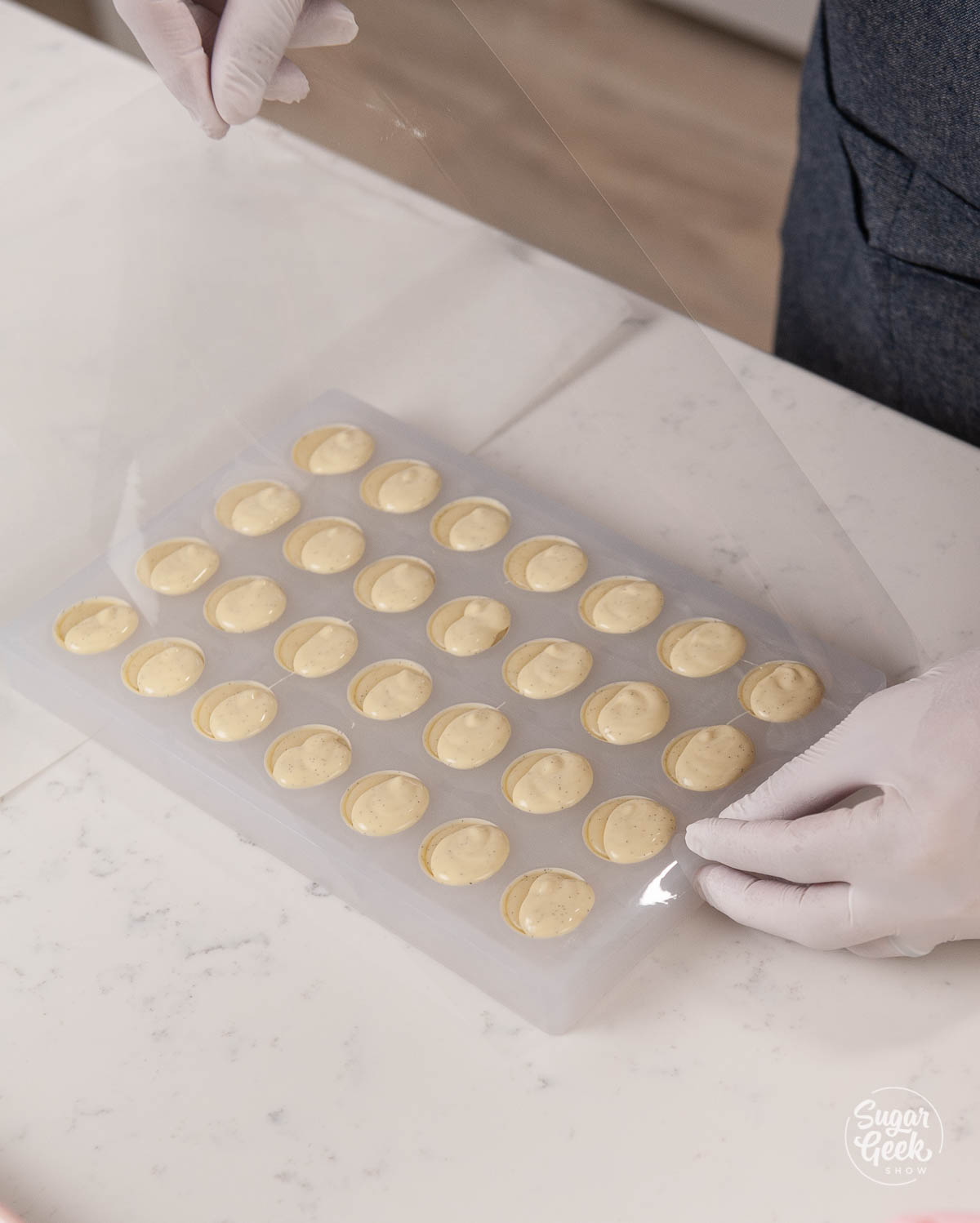 placing acetate on the back of the bonbon mold