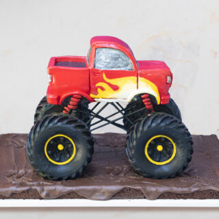 Cake sculpted to look like a monster truck