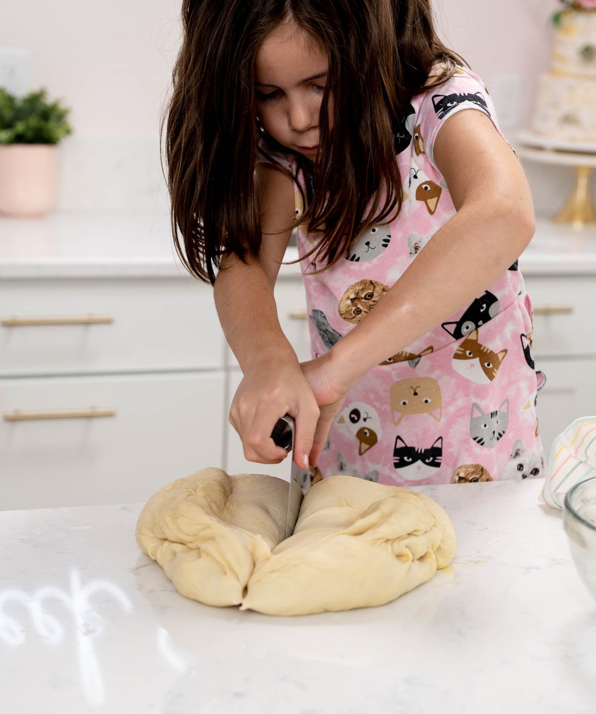 dividing bread dough into two