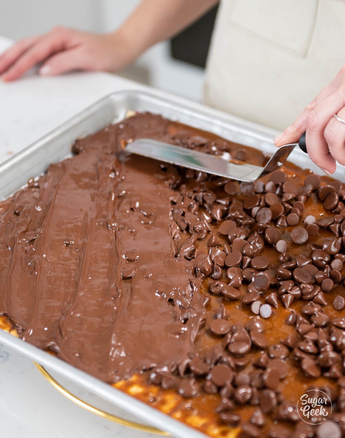 smoothing chocolate chips with an offset spatula