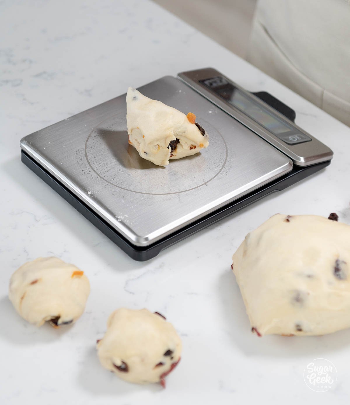 portioning panettone dough using a kitchen scale
