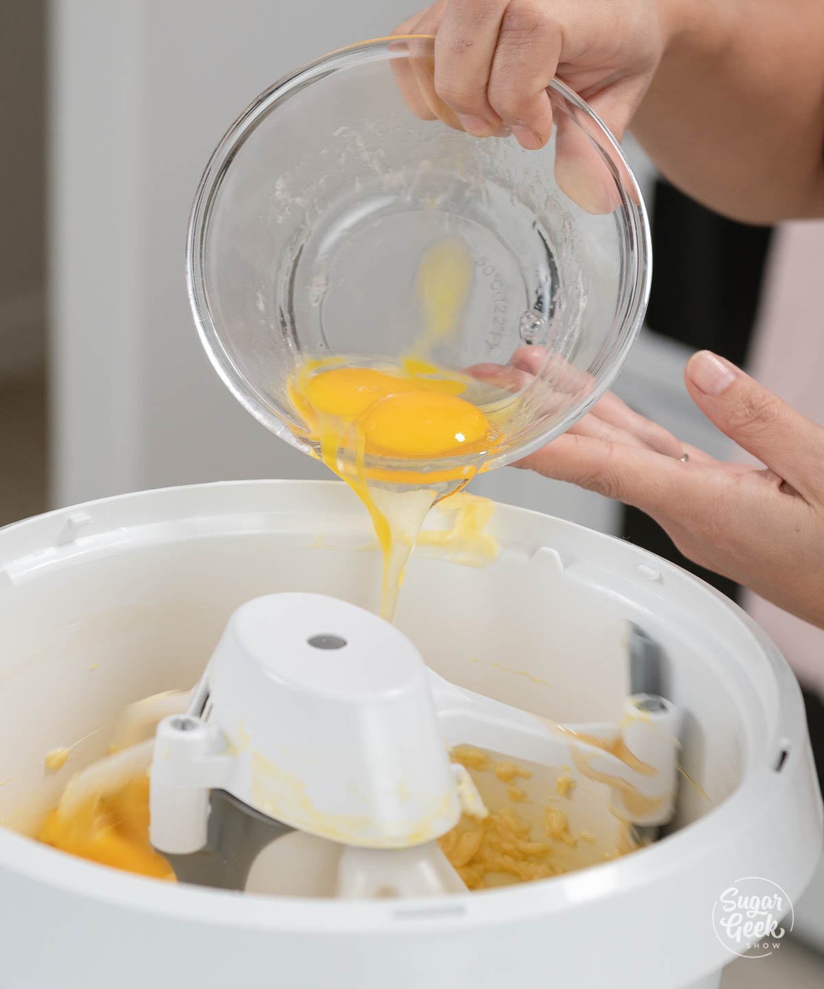 adding eggs to butter and honey mixture