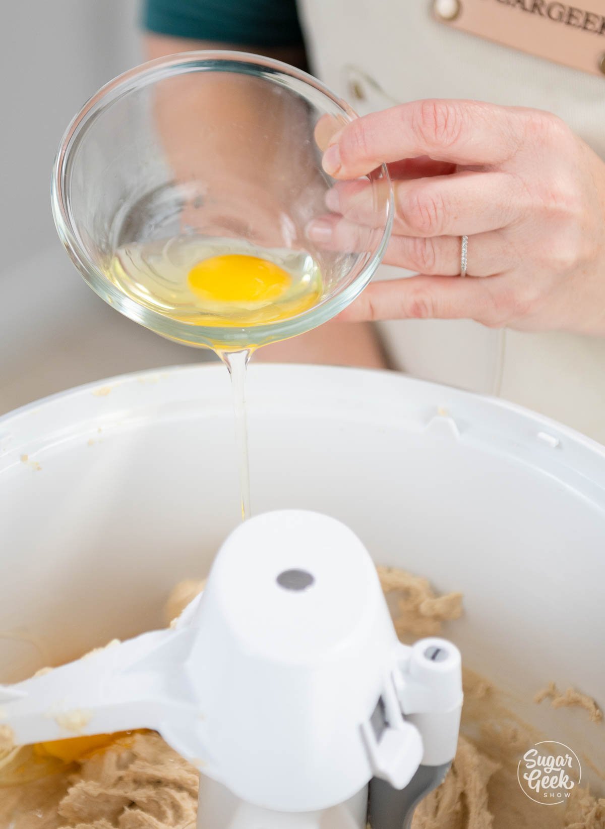 adding eggs to butter and sugar mixture
