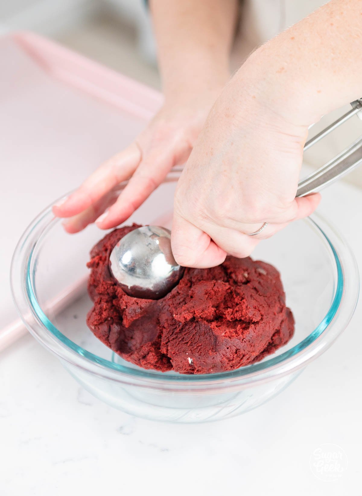 scooping red velvet cookie dough