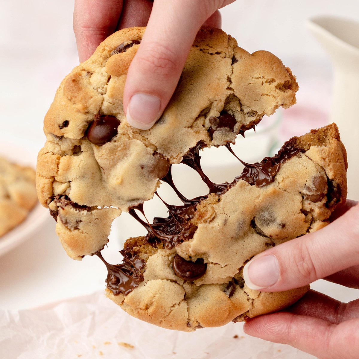 hand pulling cookie apart chocolate melting inside