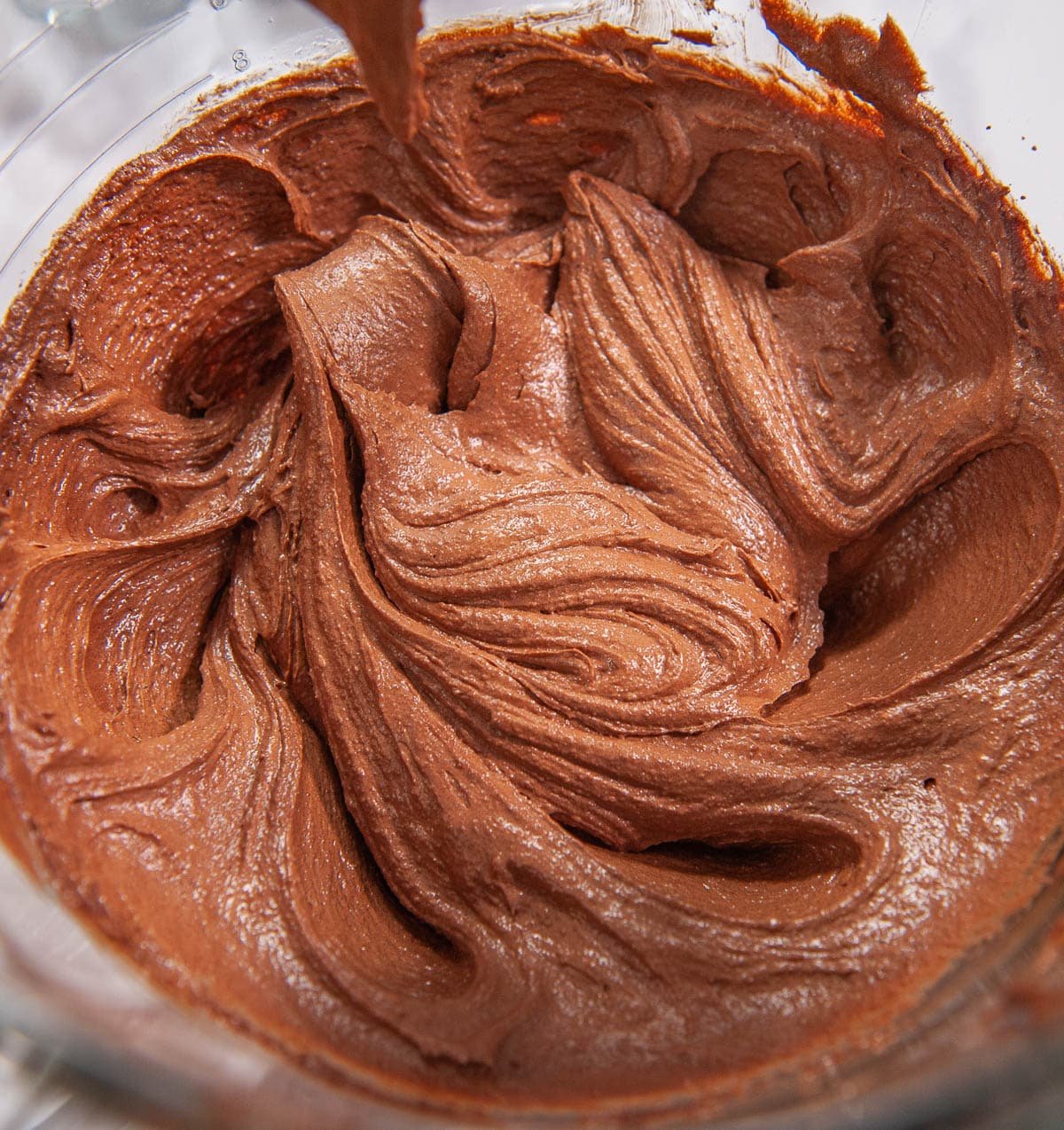 closeup of whipped eggs, cocoa powder, and butter