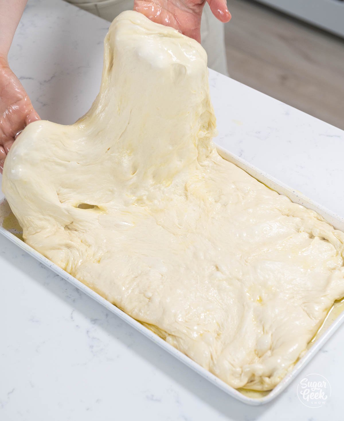stretching focaccia bread dough