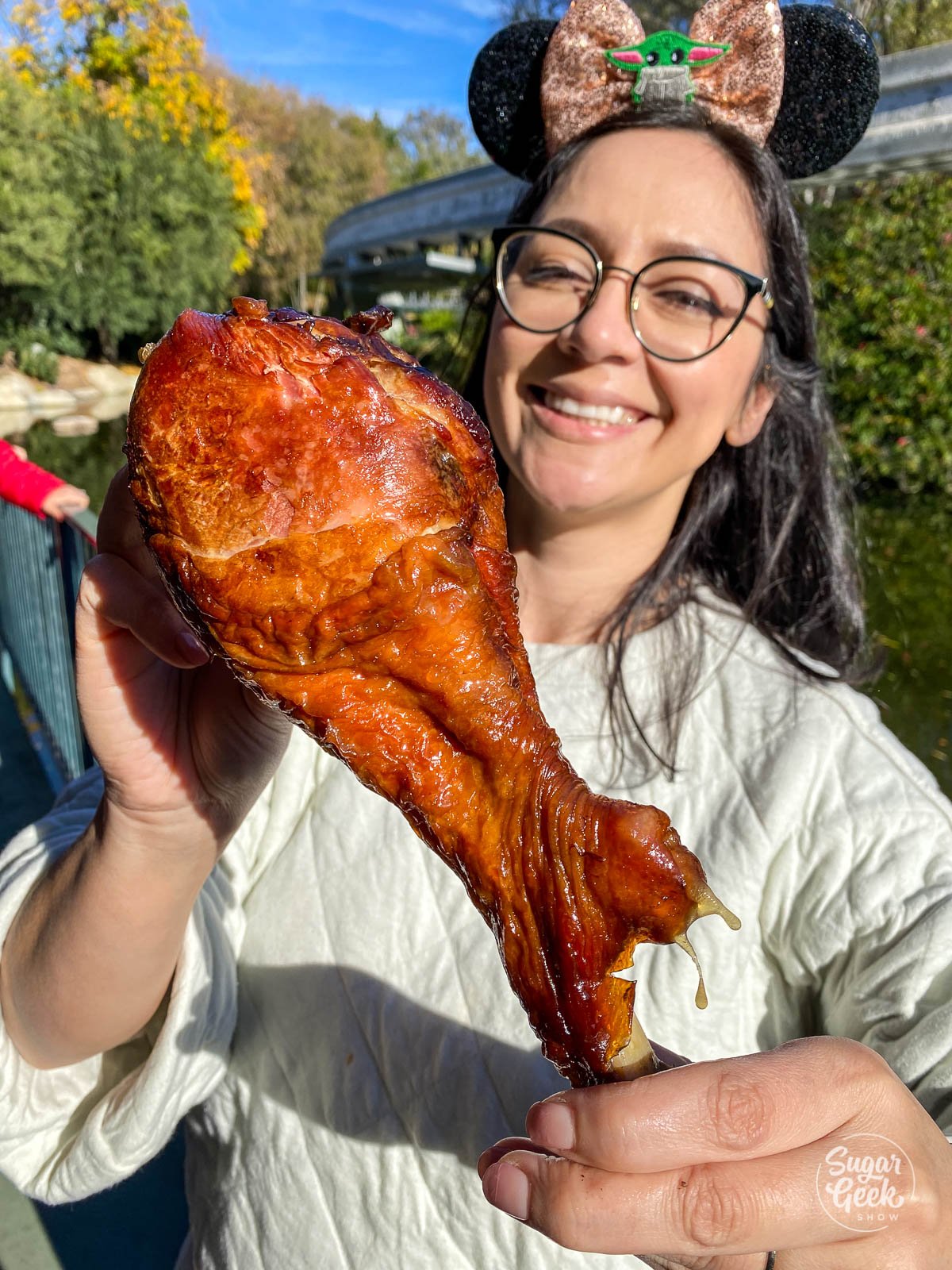 woman holding a Disneyland giant turkey leg