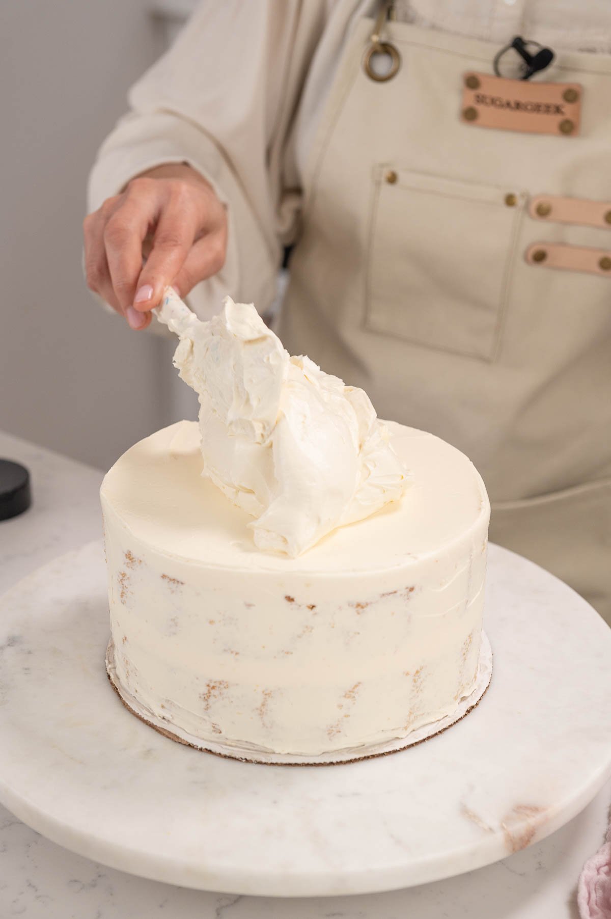 crumbcoat on a vanilla cake