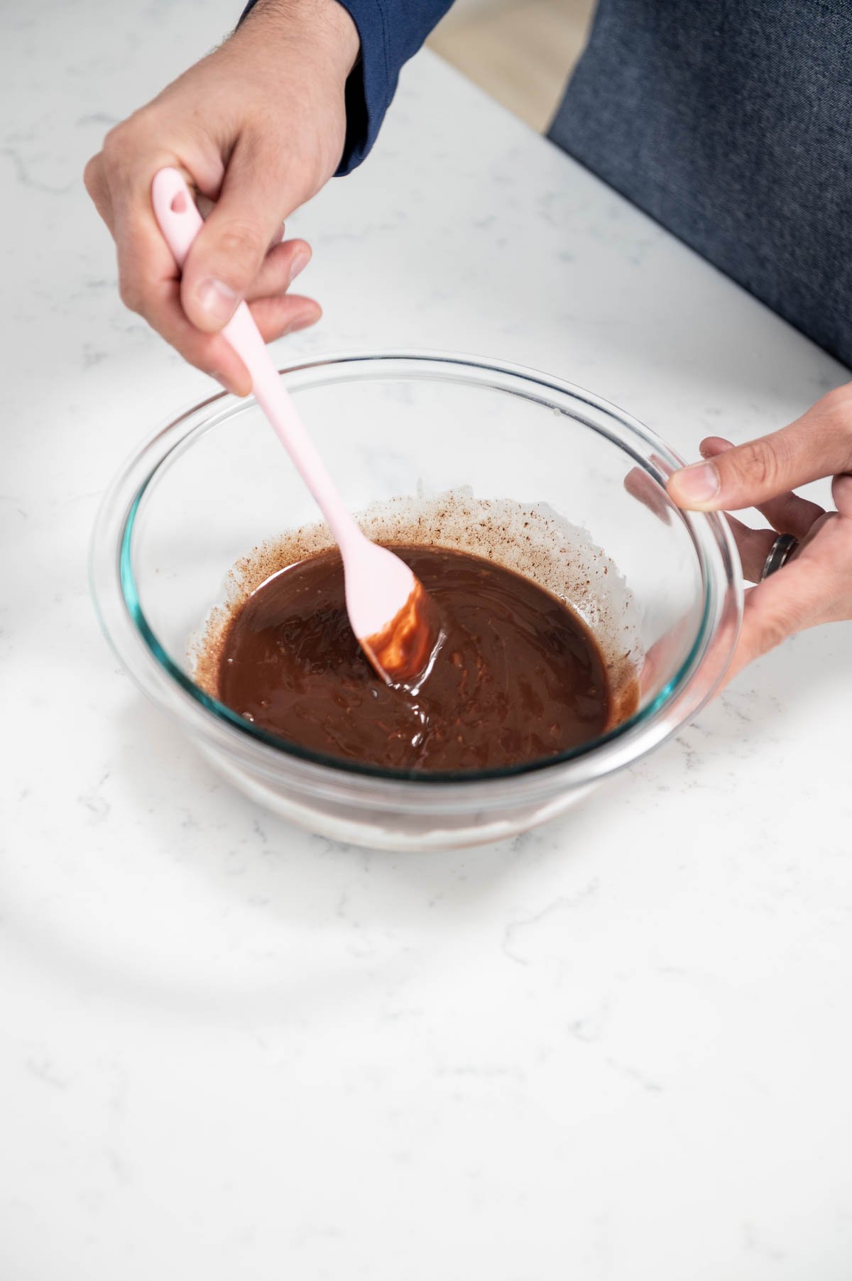 using spatula inside mixing bowl