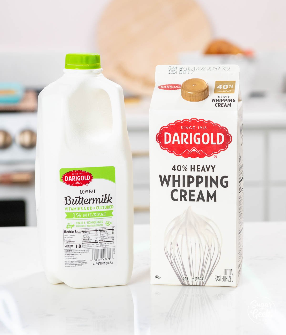 a container of low fat buttermilk next to carton of heavy whipping cream