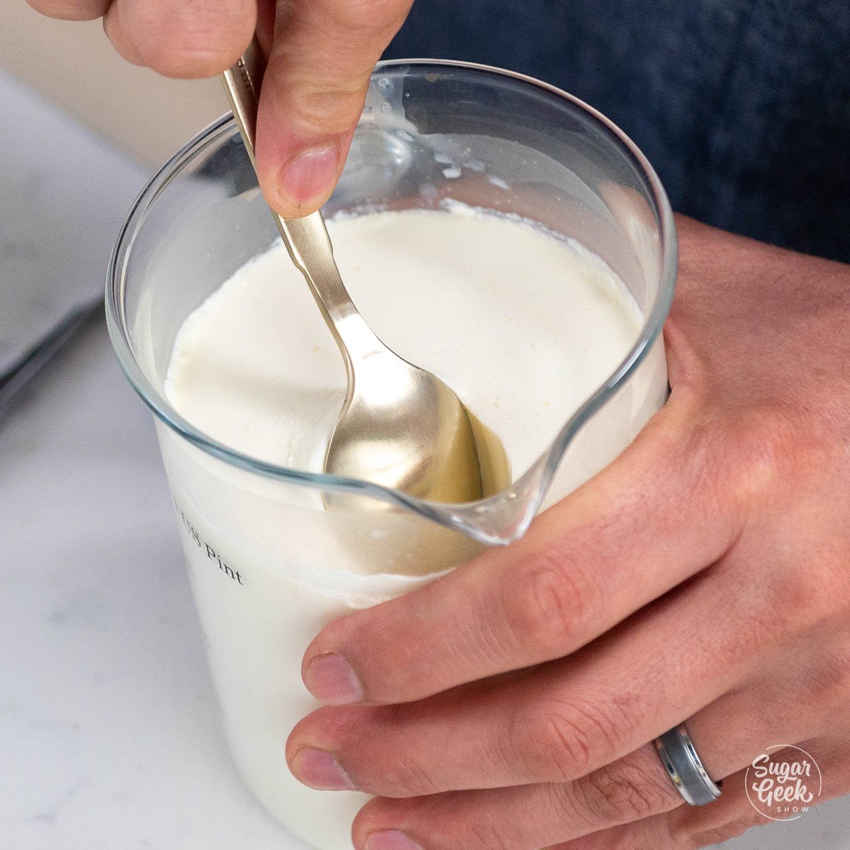 scooping creme fraiche from container