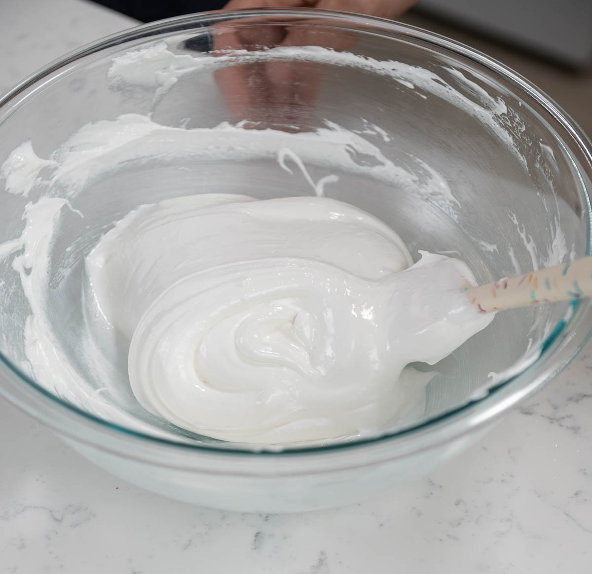 bowl of cream with spatula inside