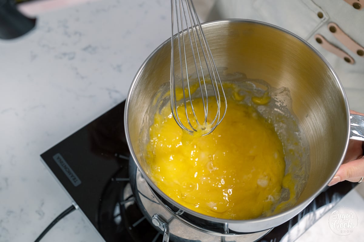 whisking egg mixture in a bowl